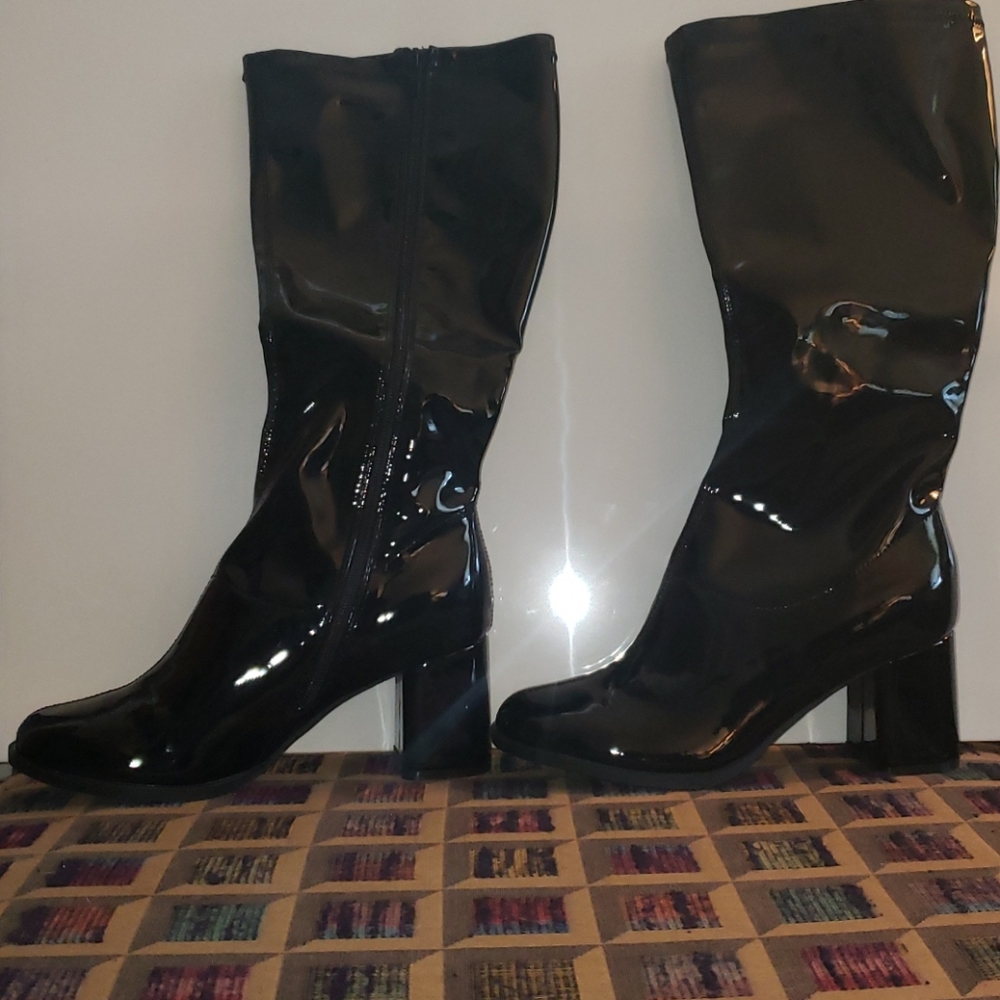 Black knee-high patent leather boots